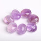 Amethyst tumbled stones placed in a circular way